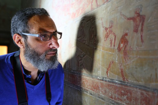 nautical archaeologist, mohamed abd el-maguid, examining markings on the wall as seen in lost secrets of the pyramid.